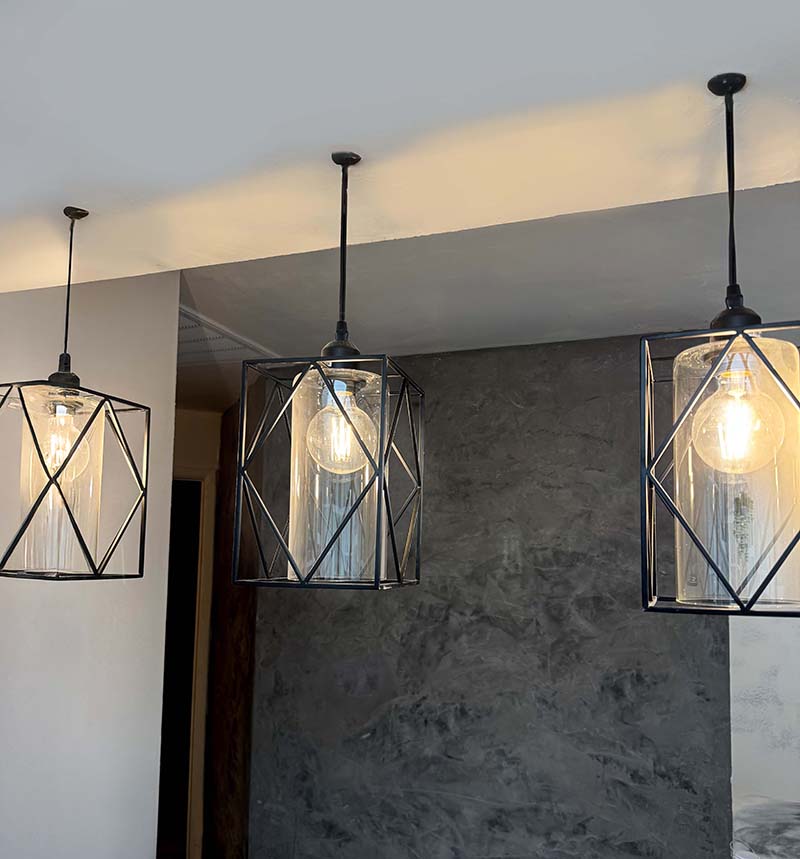 Charcoal wall, glass pendants