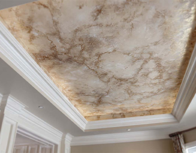 Antiqued gold-veined plaster ceiling in a coffered tray