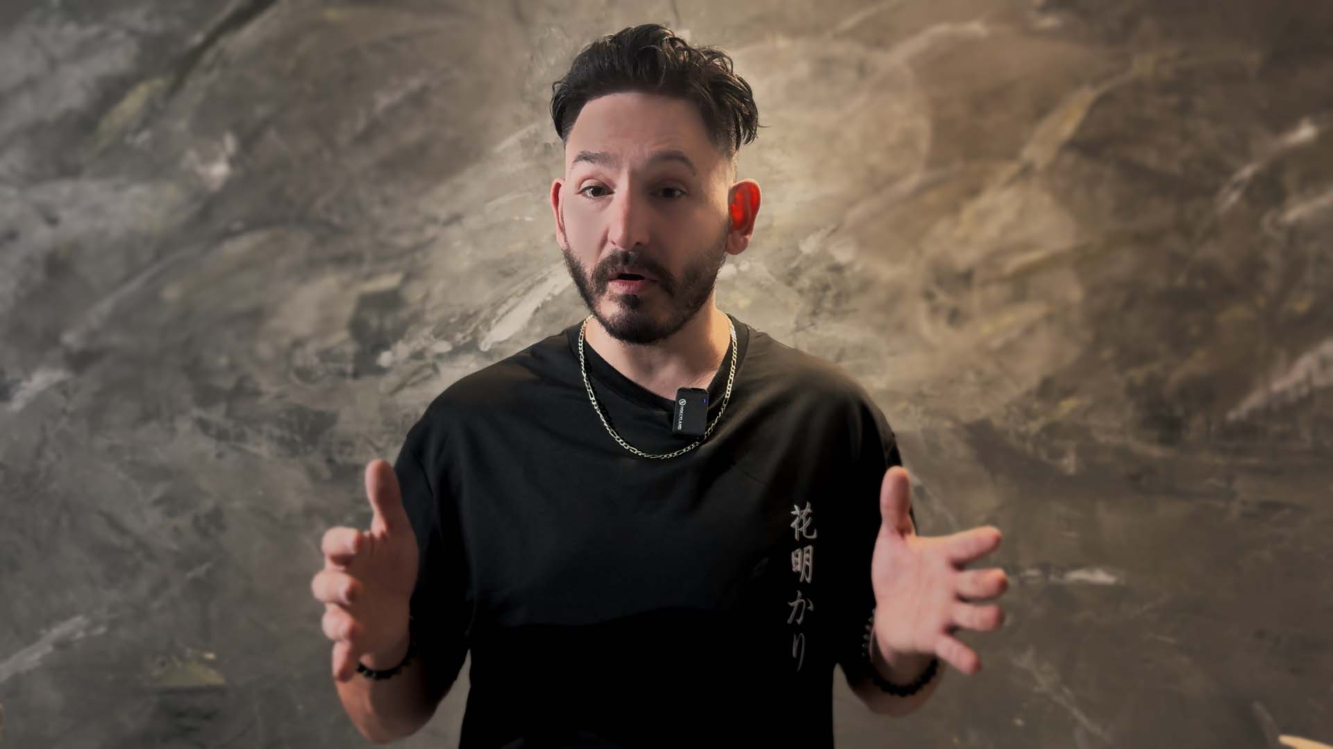 Sebastien Ricci, founder of Venezario Design, before a finished plaster wall