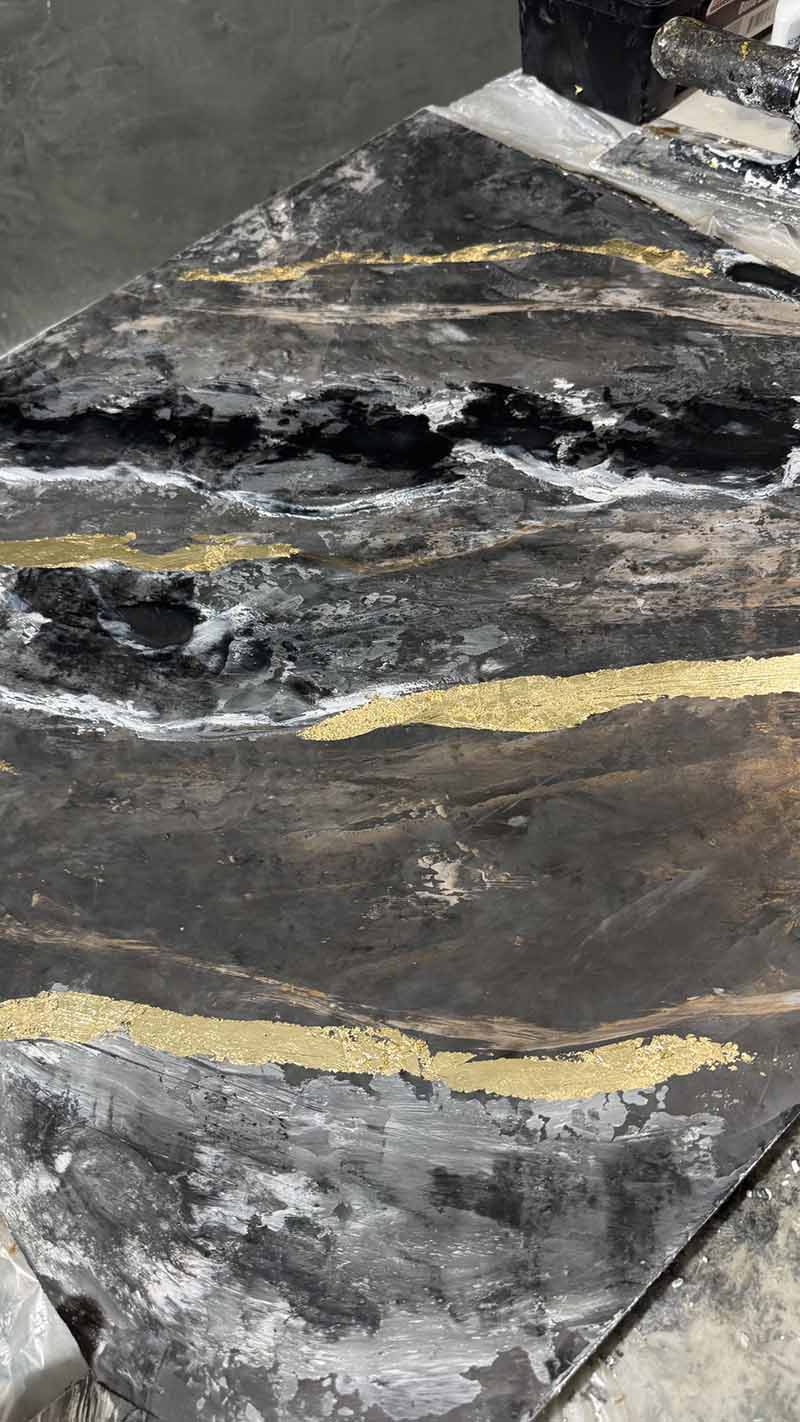 Black metallic epoxy with poured gold-leaf veining